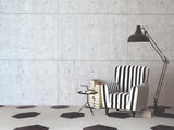 hexagon tile in black and white patter with black and white chair.
