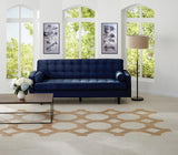 museo square tile on floor with trellis deco and blue couch in living room.