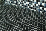 matte ebony hexagon tiles on the floor, exotic mosaic on the wall