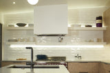 italian alps white artigiano ceramic wall tile pictured on a kitchen backsplash with lighting