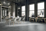 simply grey tiles in large open concept office with large city windows