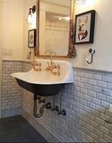 Elegant bathroom sink basin and mirror against beveled marble brick tile