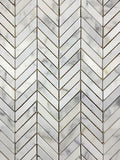 Honed/polished, monochromatic marble tile pieces in chevron mosaic