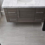 Metalwood tile in the color Argento set on a bathroom floor with view of the vanity from above